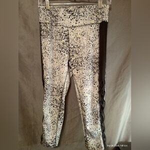 Xersion white spotted yoga leggings with cris cross sides